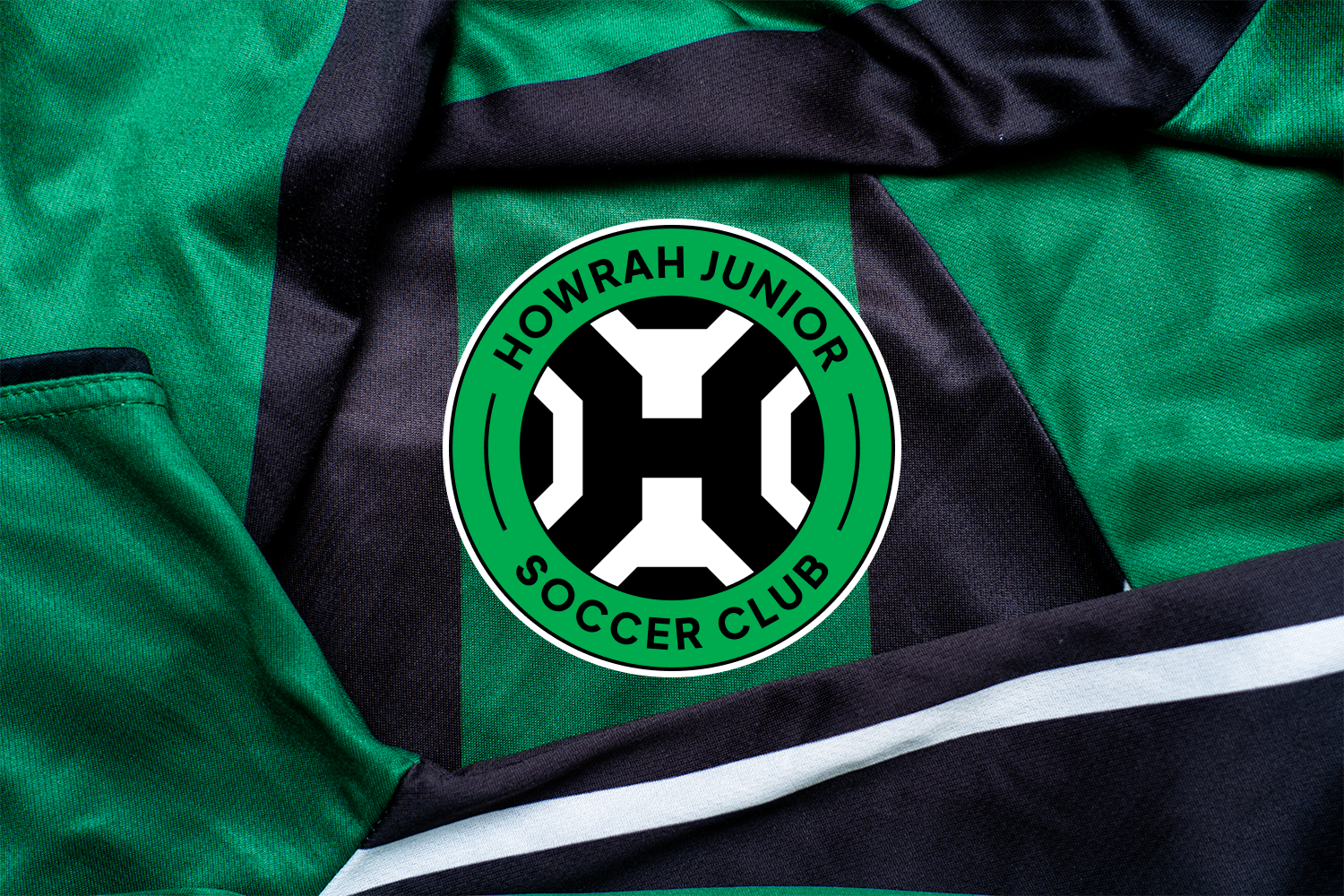 Howrah Junior Soccer Club logo on black and green playing strips